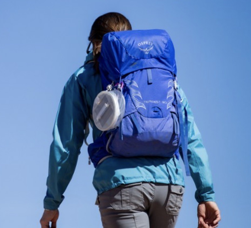 backpacker with light on pack