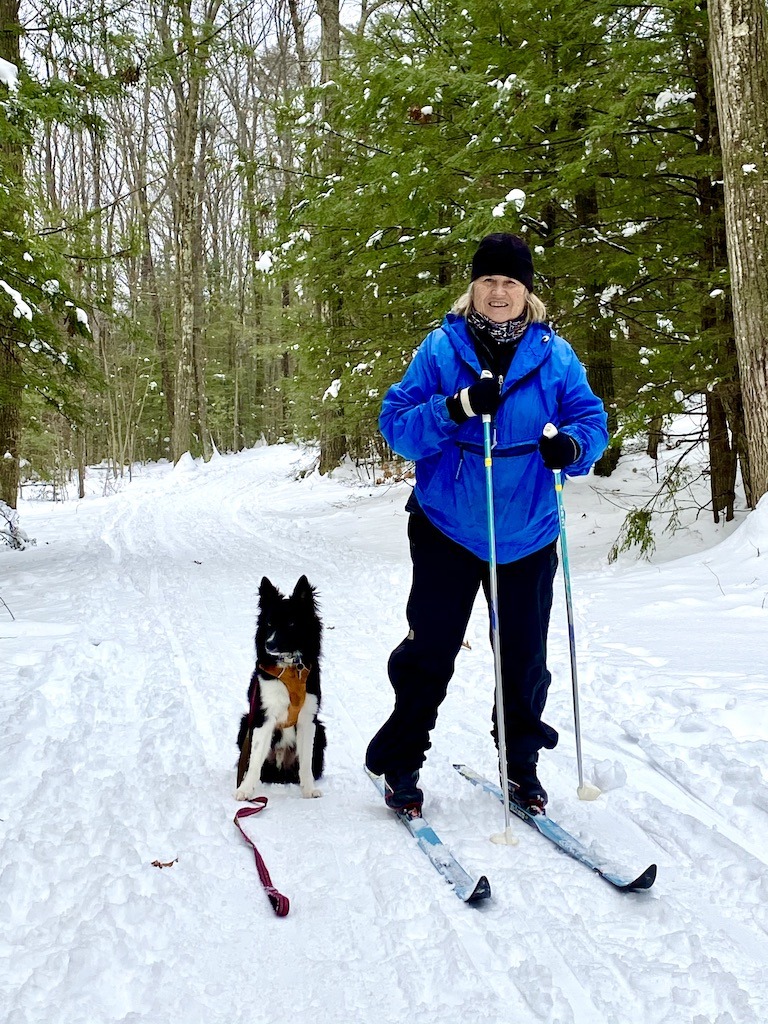 woman and dog skiing -outdoor-adventure-reflections-for-2020