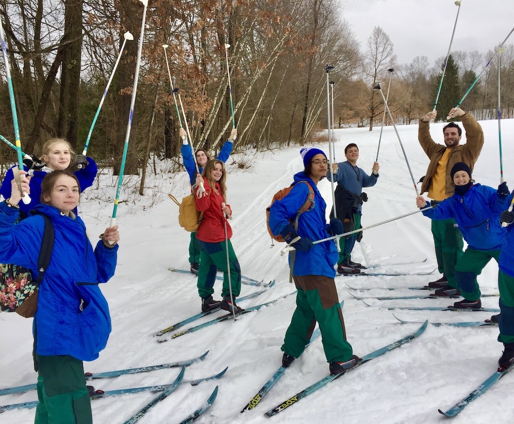 Skiers raising poles -free cross country skiing Vermont