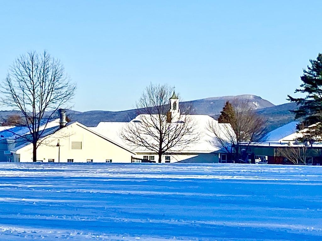white building with mountain in the background-free cross country skiing near Hanover, New Hampshire