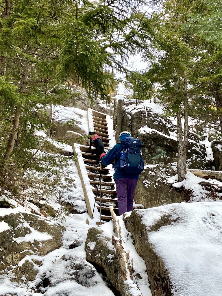 hiker and dog climbing stairs on Easy hikes in the Adirondacks