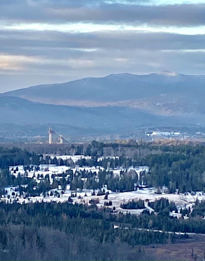 view of Olympic Jumping towers and Lake Placid on an Easy hike in the Adirondacks