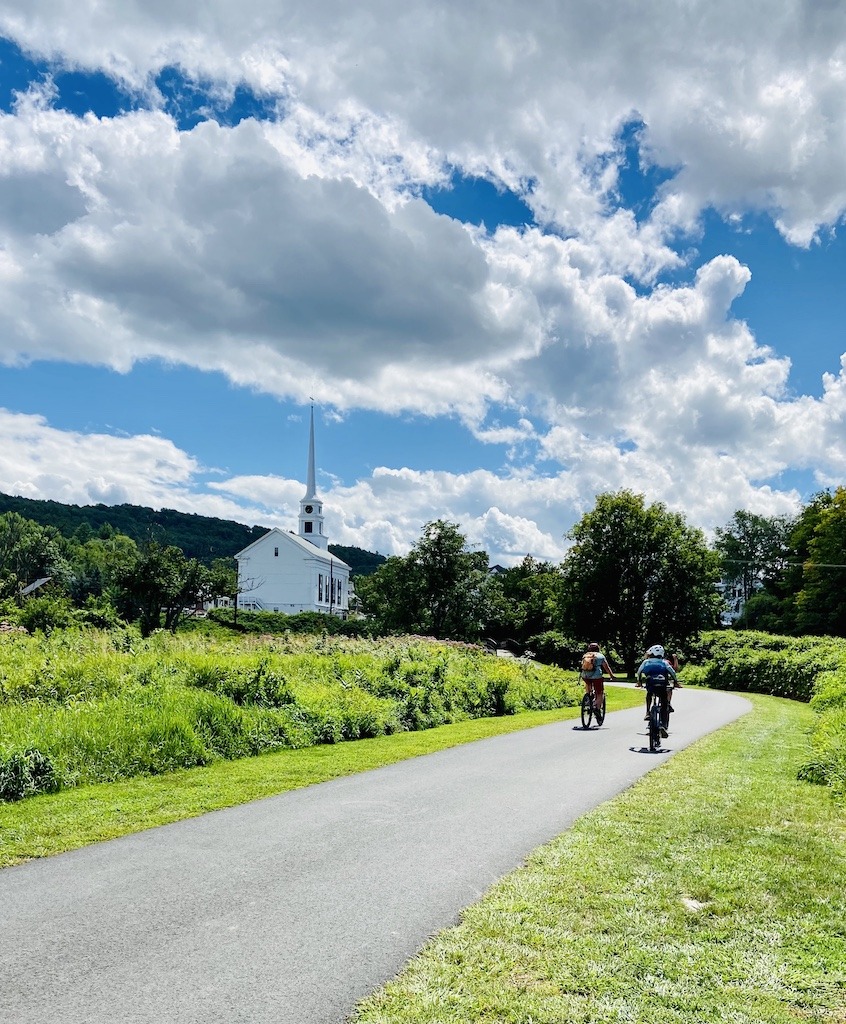bikers and church on the best bike trails in Vermont