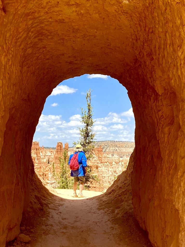 person in tunnel on canyon adventures in the Southwest USA at Bryce National Park