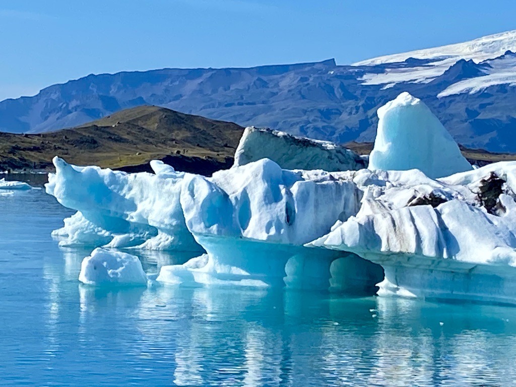 glacier in water with mountain in background-outdoor adventures in Iceland