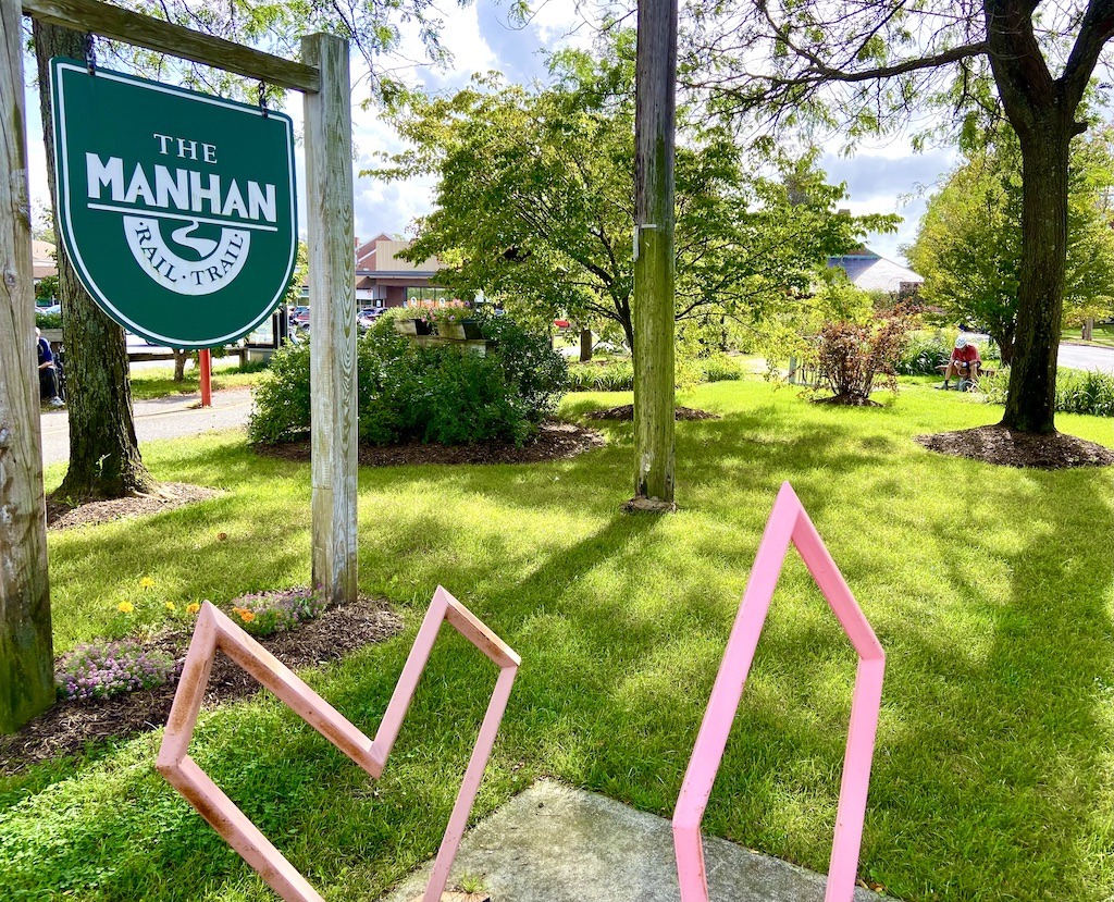 Sign and heart shaped pink bike rack on one of the best bike trails in Western Massachusetts