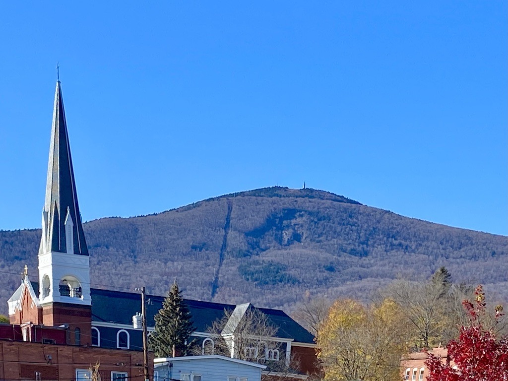 church steeple and mountain on one of the best bike trails in Western Massachusetts