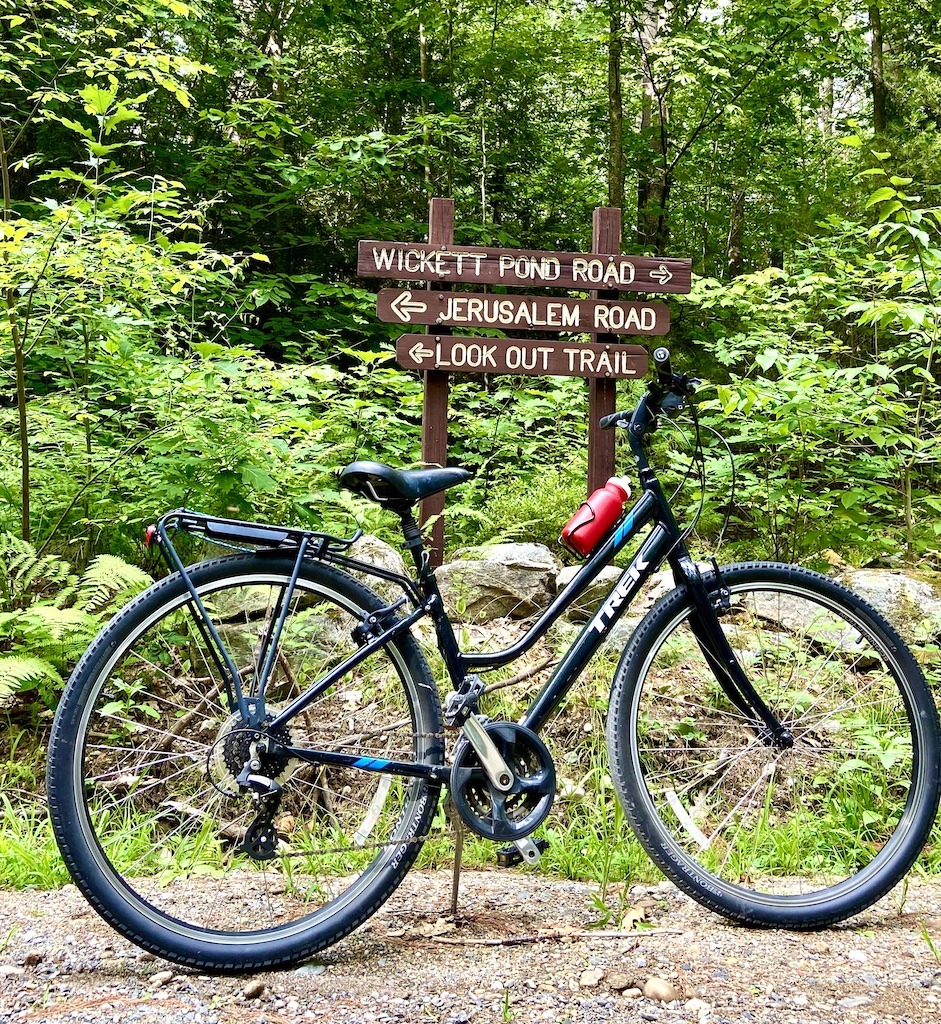 bike in front of trail sign