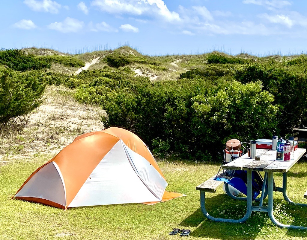 camping tent and picnic table on dunes-one of the many outdoor adventures on Ocracoke Island