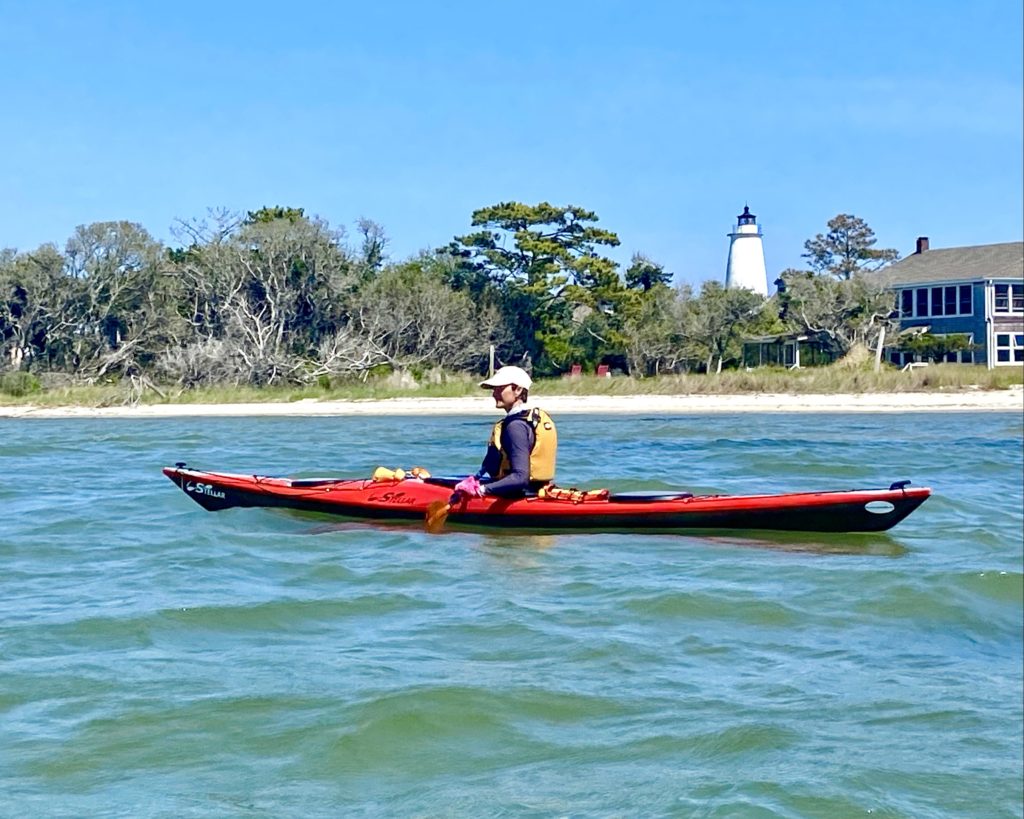 red kayak with lighthouse for Outdoor Adventures on Ocracoke Island