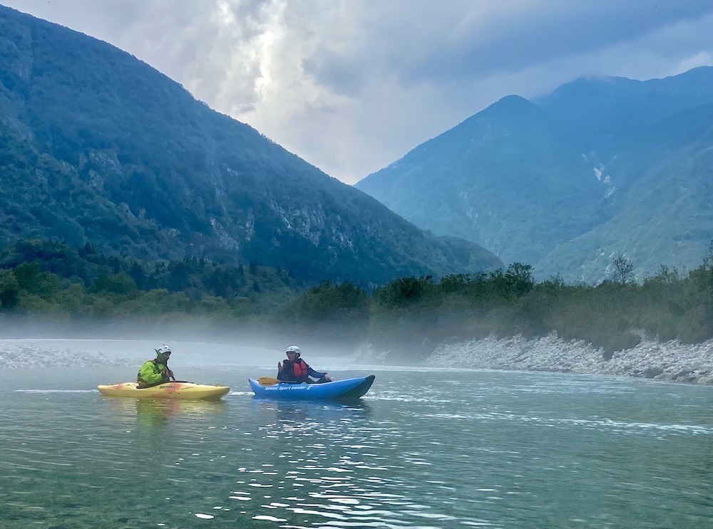 2 paddlers in mist-one of the outdoor adventures of Slovenia
