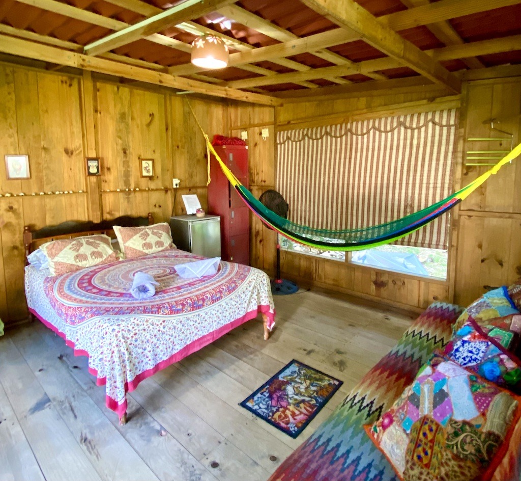 inside cabin-colorful bed and hammock