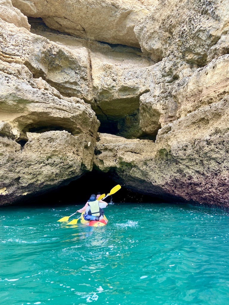 sea kayaking into one of the Benagil caves