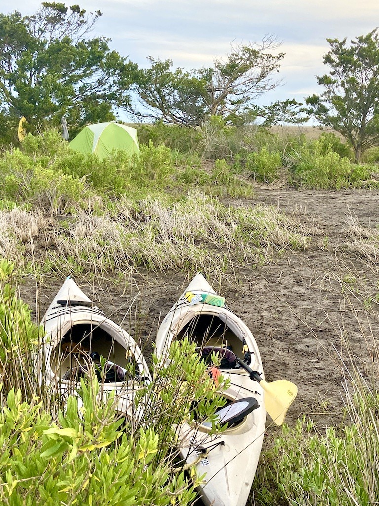 2 kayaks and green tent-kayaking and camping on Masonboro Island