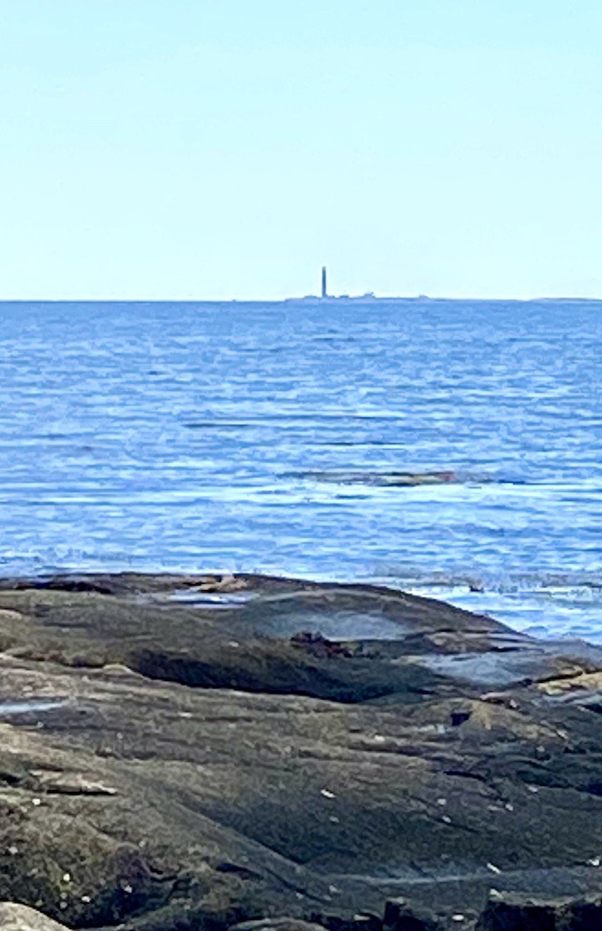 lighthouse in distance-Downeast Maine outdoor adventures