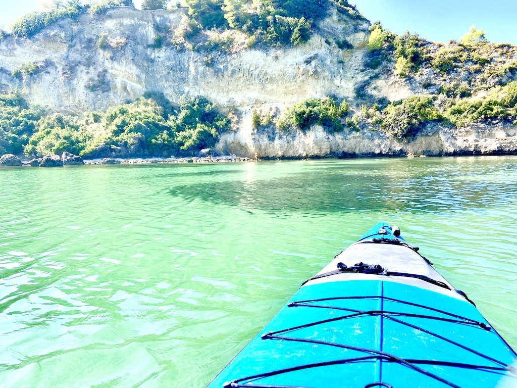 bright blue kayak and greenish water-sea kayak on Kefalonia