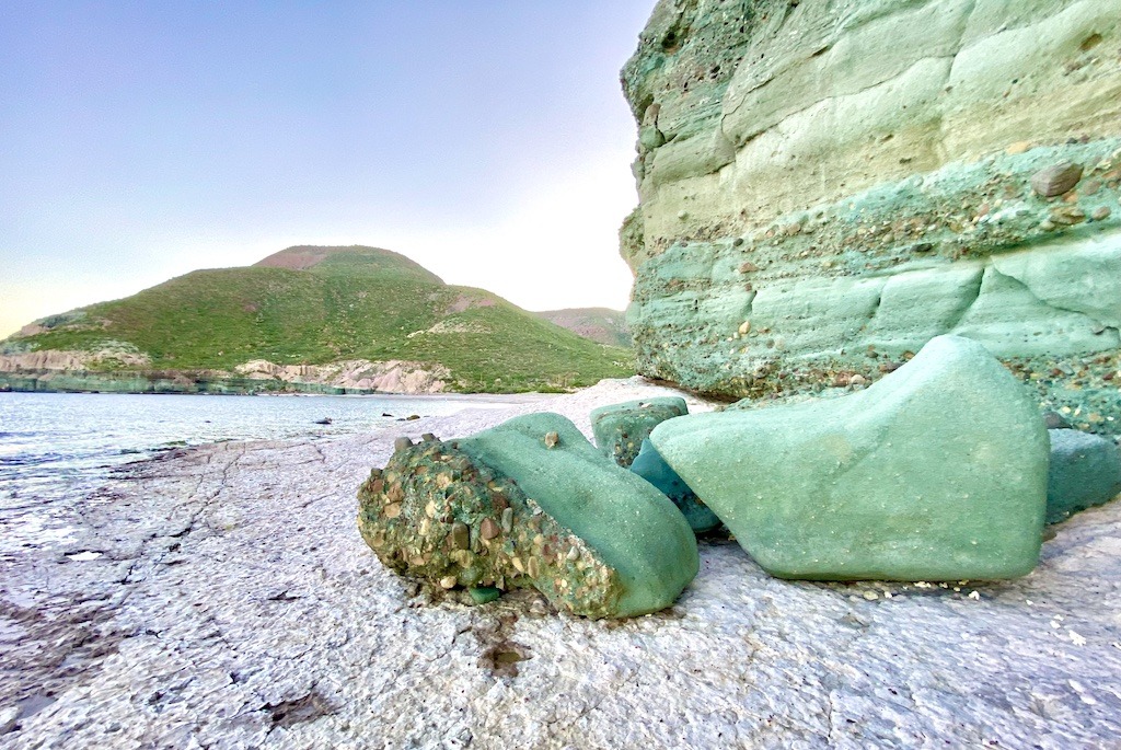 Beach with large green rocks-Sea Kayaking in Baja