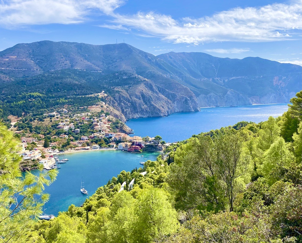 town surrounded by blue water and mountains-Outdoor Adventures of Kefalonia