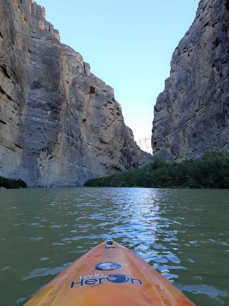 orange kayak in canyon-best kayaking day trips in the US