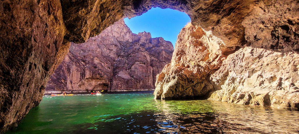 kayaks under arch-best kayaking day trips in the US