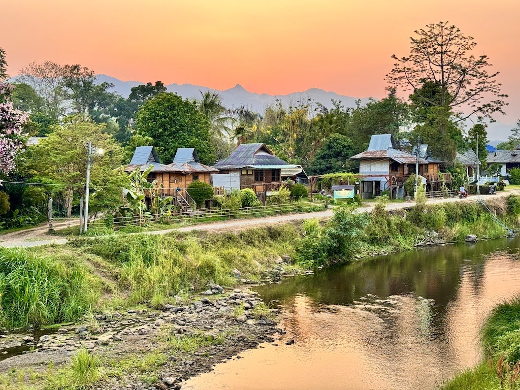 houses near river at sunset-Outdoor Adventures in Pai