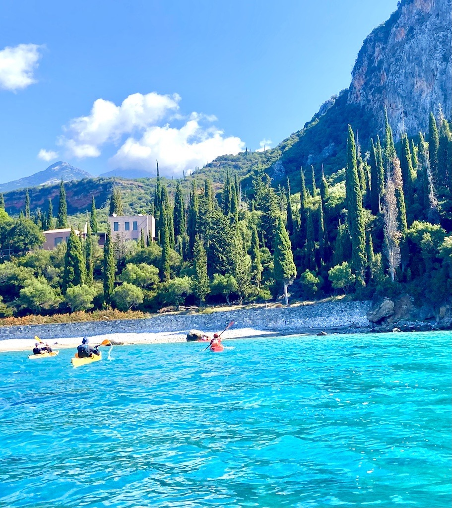 kayakers approaching beach-kayaking day trips in Europe