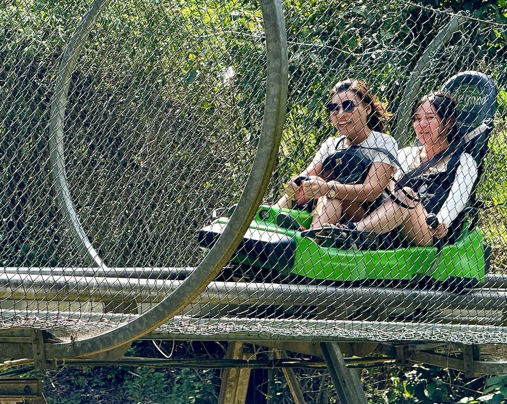 people riding a green coaster-outdoor adventures of Dalat