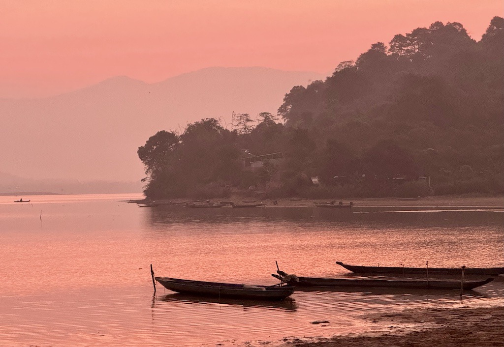 boats on a pink lake at sunrise-outdoor adventures of Dalat