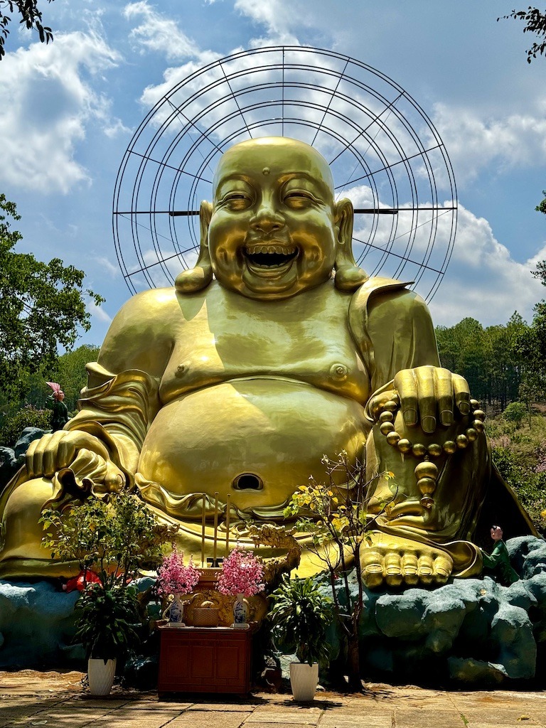 large golden Buddha smiling on Easy Rider Tour