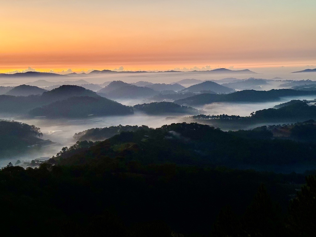 sunrise clouds over mountain-outdoor adventures of Dalat