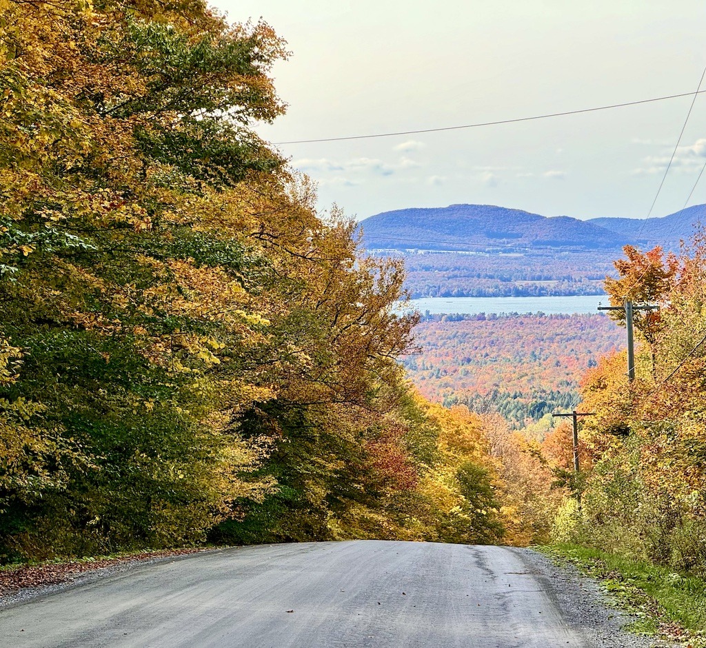 Lac-Brome in the distance amid yellow and orange leaves on bike routes of the Eastern Townships