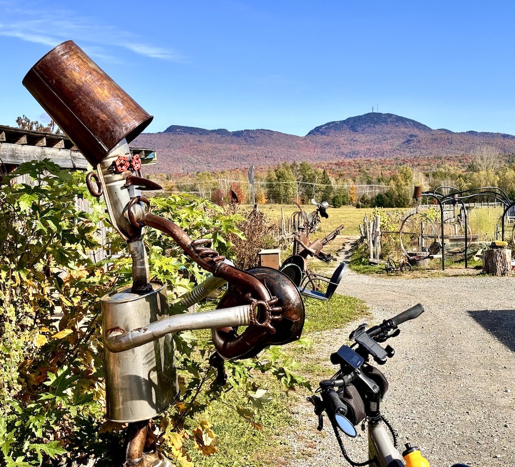 bike nare steel character with mountain in the background-bike routes of the Eastern Townships