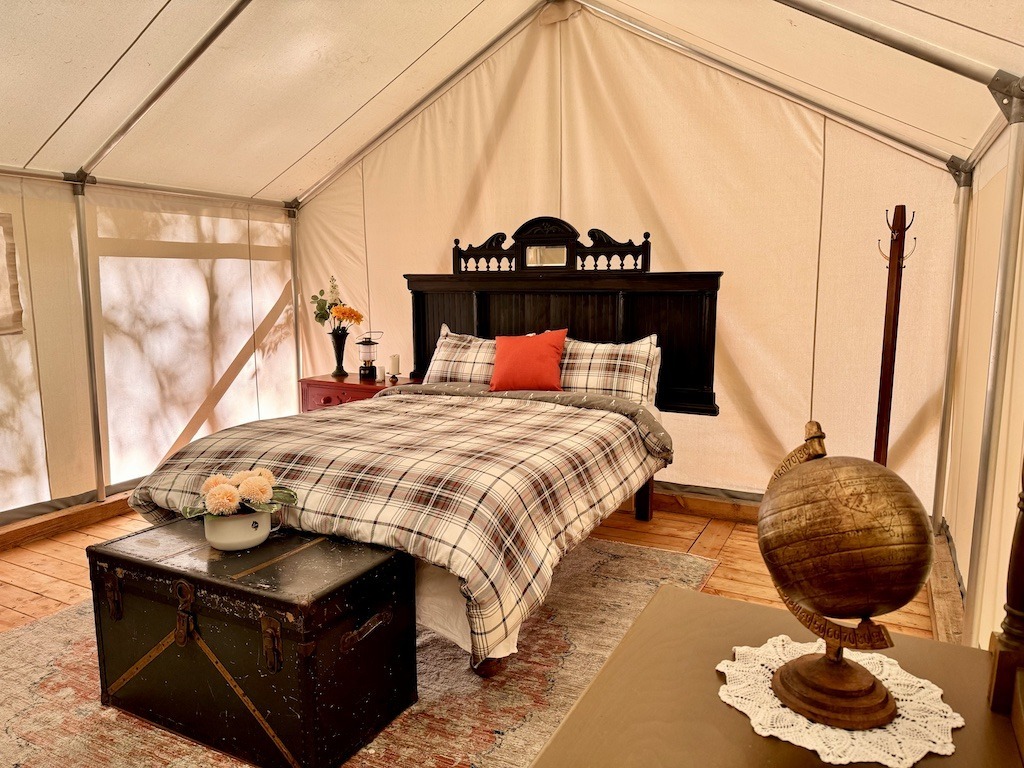 bed in white tent-Glamping in the Eastern Townships