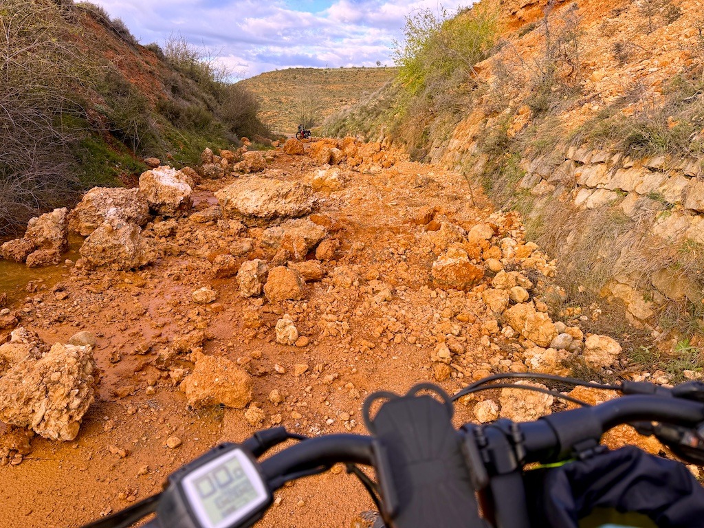 red mud and rocks and bike-biking on the Ojos Negros Greenway