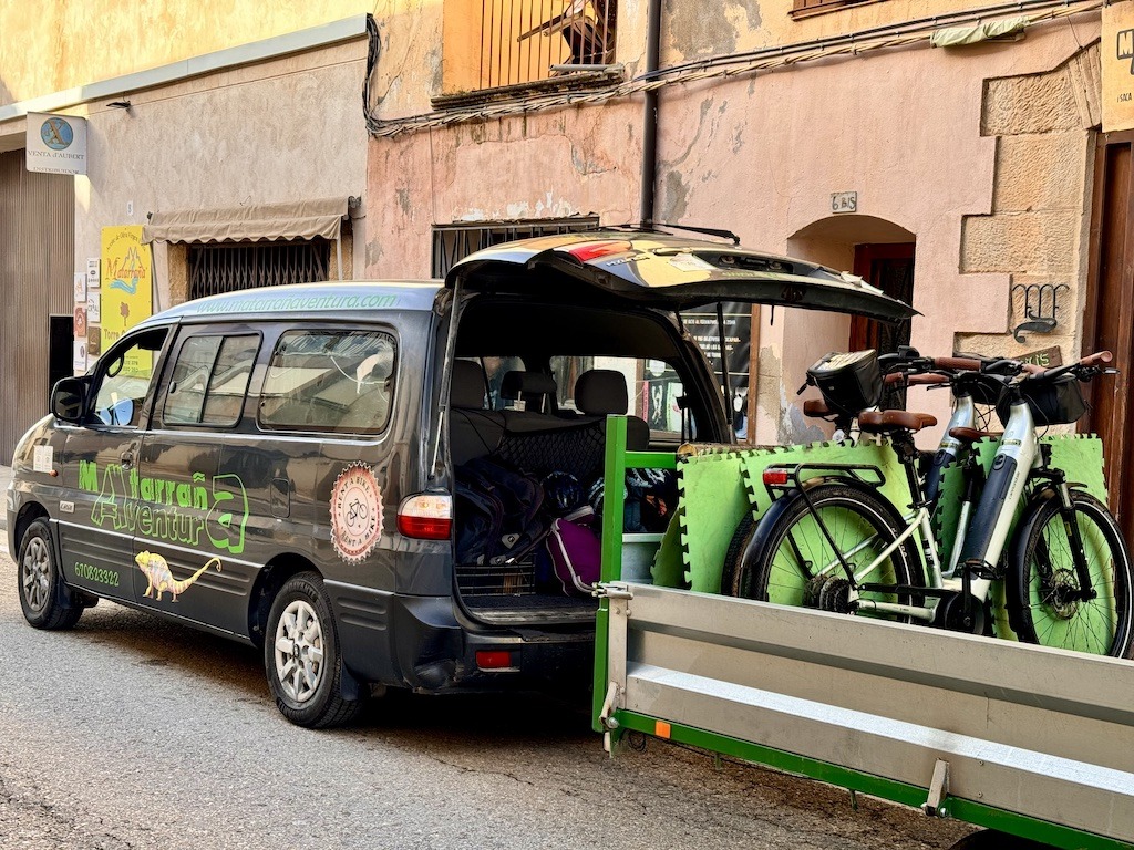 black van with bike trailer