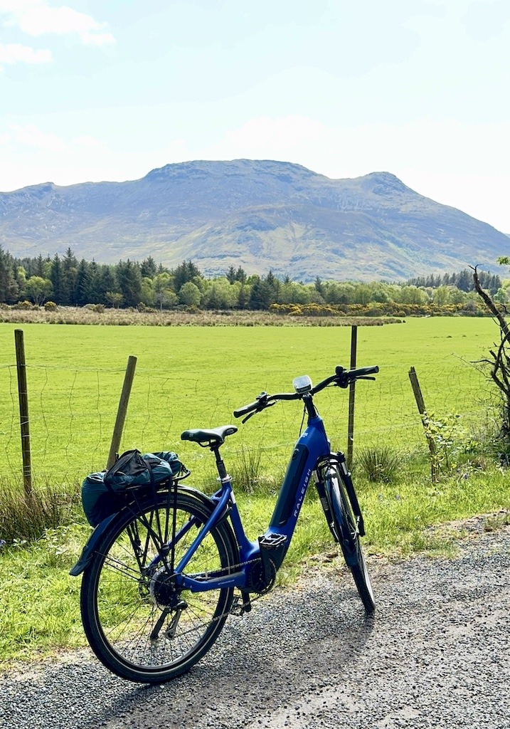 blue bike and mountain while  on E-Biking Trips in Scotland