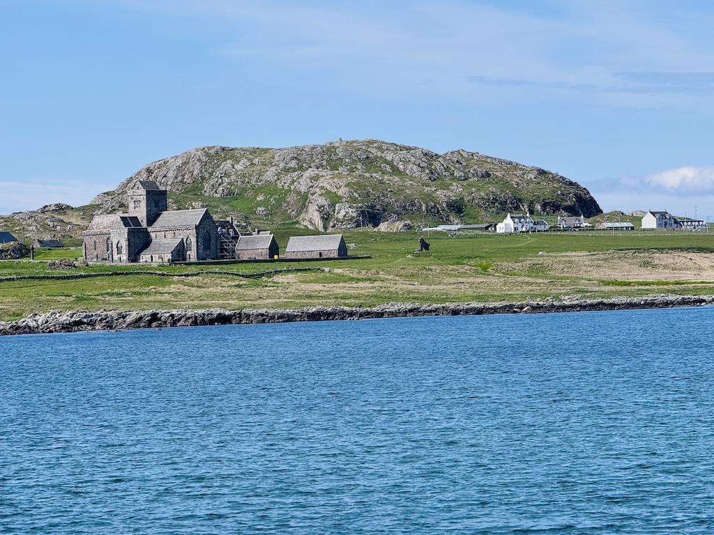 old buildings and mountain on the ocean