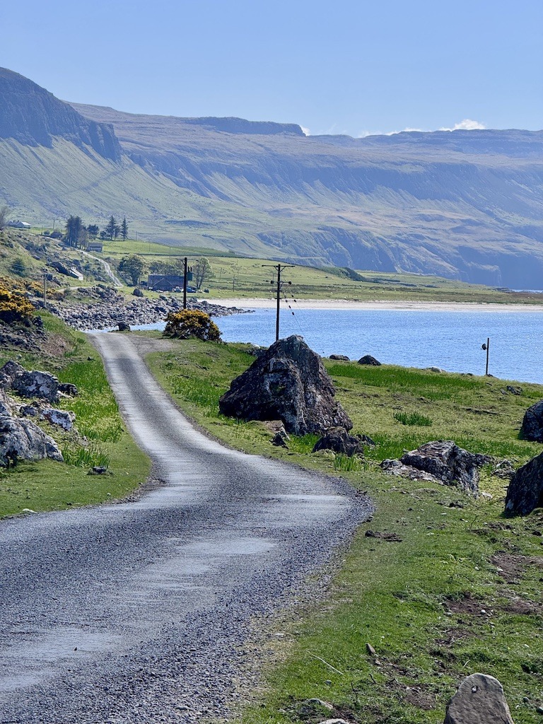 Road along ocean and beach while on E-Biking Trips in Scotland