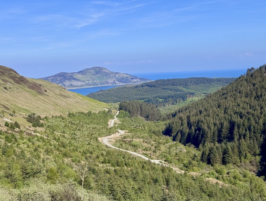 Green valley with road while on E-Biking Trips in Scotland
