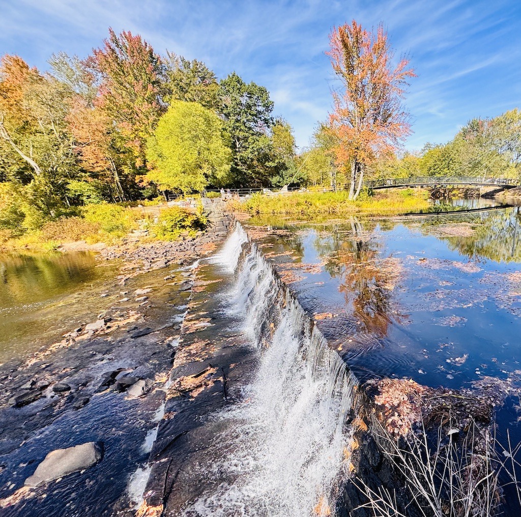 waterfall and autumn leaves while biking in Southern New Hampshire