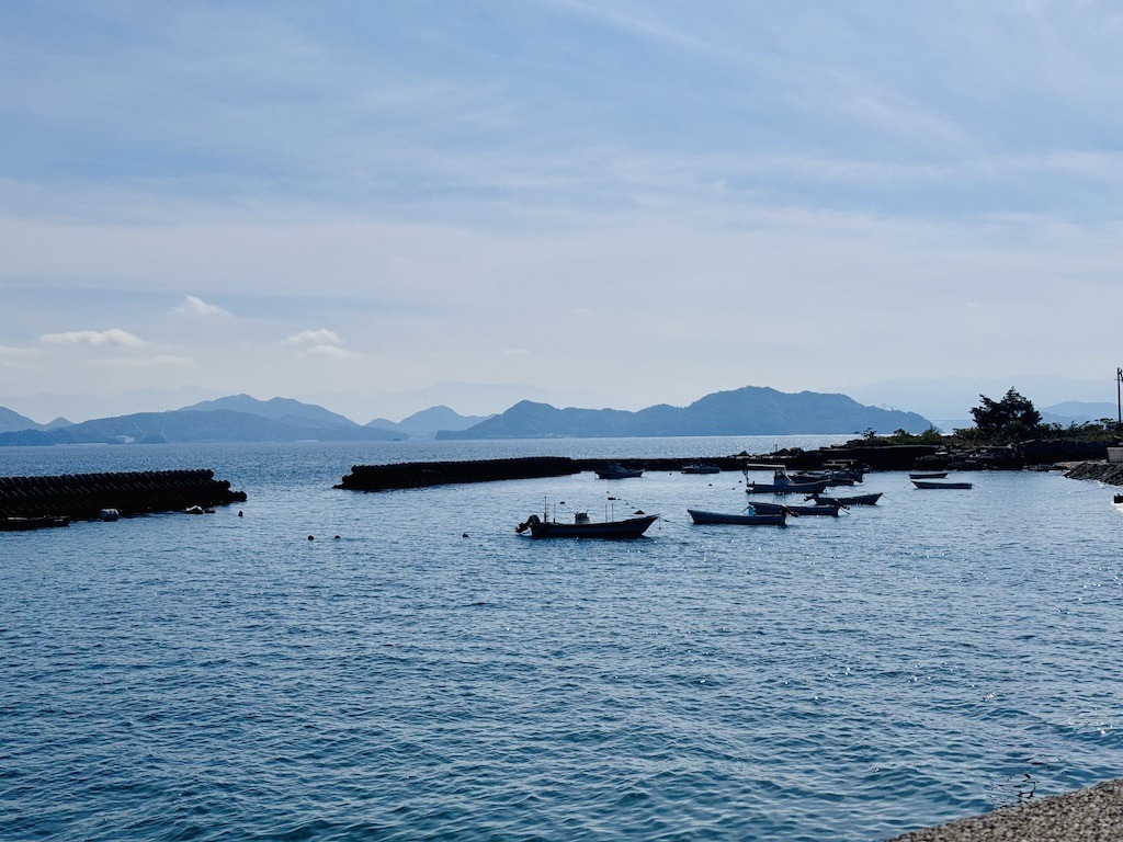 fishing boats and mountains while biking the Shimanami Kaido