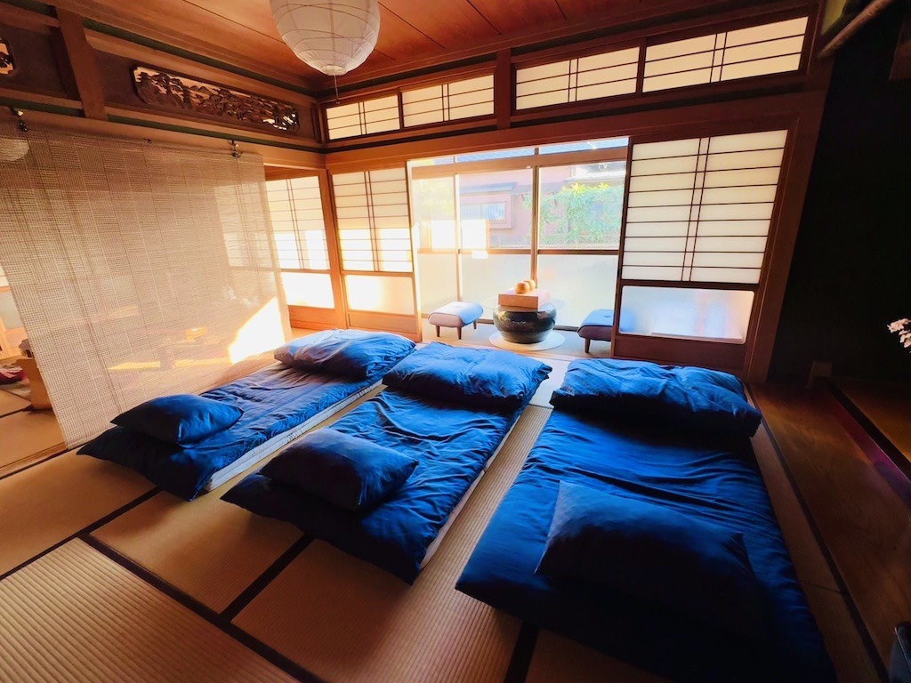 3 blue futon beds in Japanese bedroom