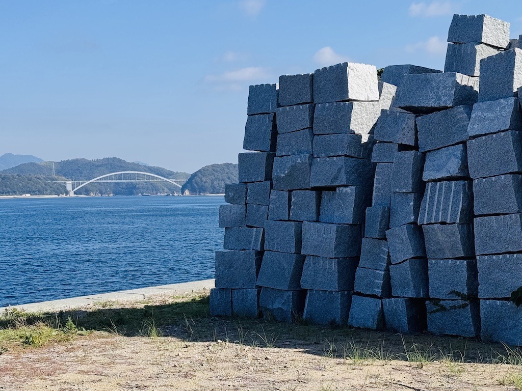 Granite blocks and bridge on a stop while biking the Shimanami Kaido