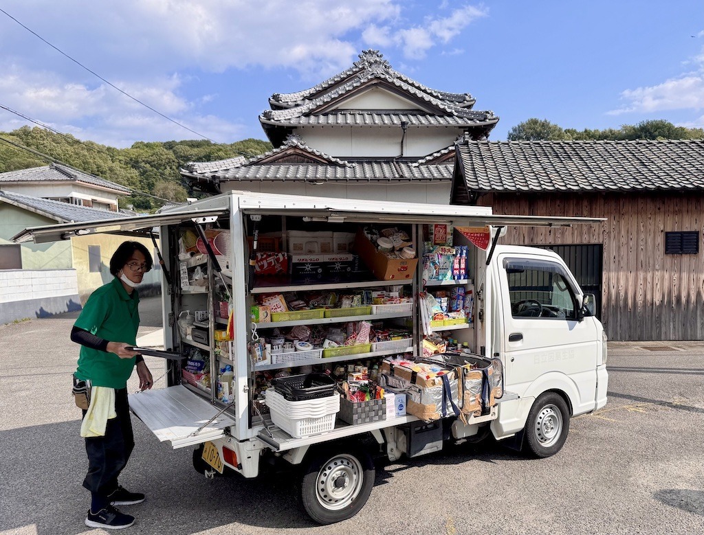 man with truck of groceries