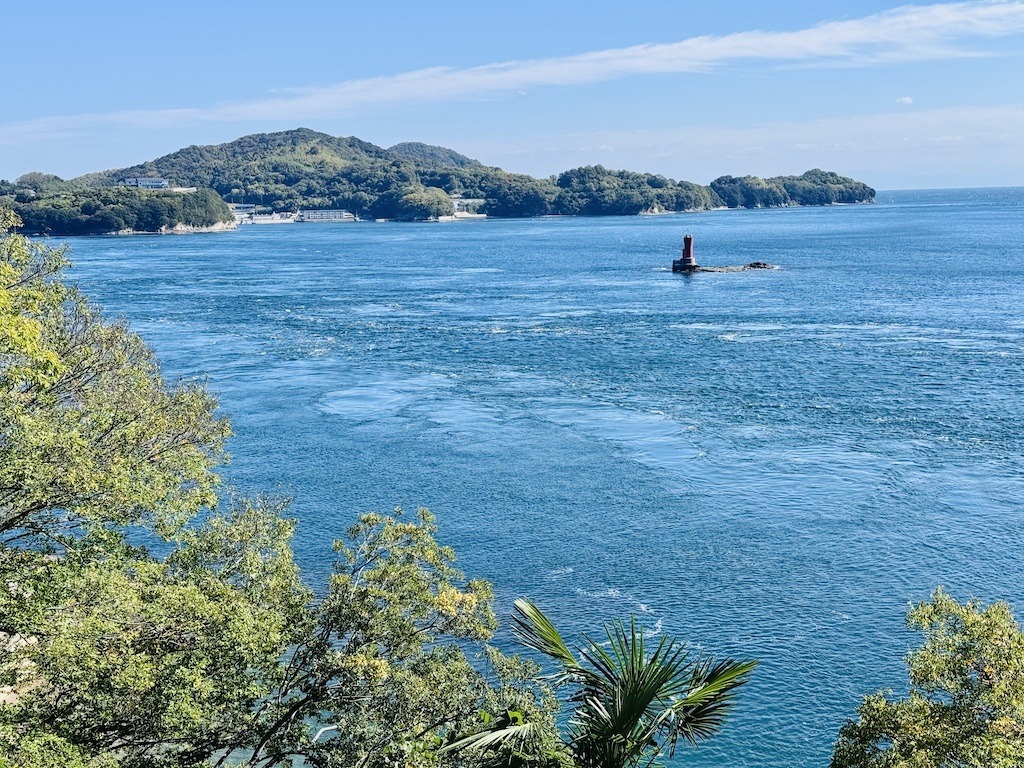 blue ocean with fast water and buoy
