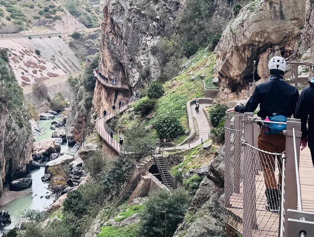 many walkways on the cliff with hikers on the Caminito del Rey hike