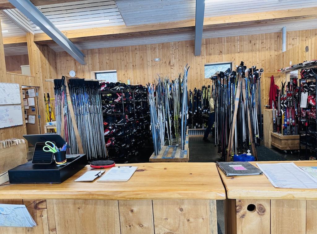 racks of skis and ski boots cross country skiing at Craftsbury