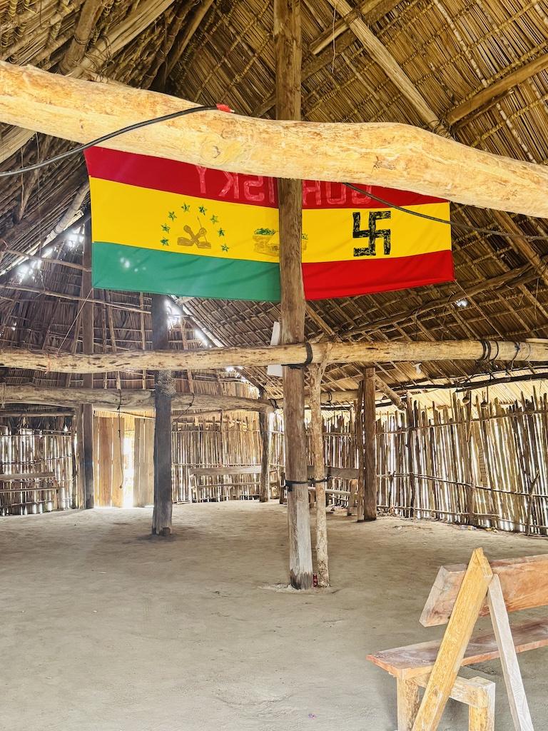 flags flying in thatched building on a Cultural Tour of the San Blas Islands