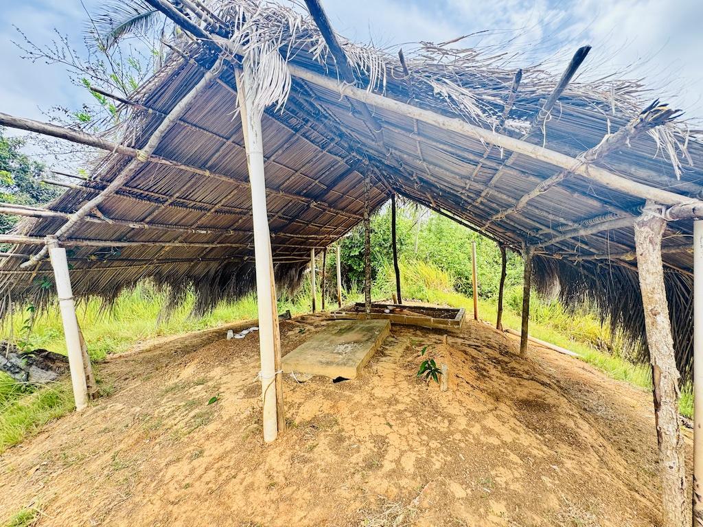 thatched roof over a sandy area on a Cultural Tour of the San Blas Islands