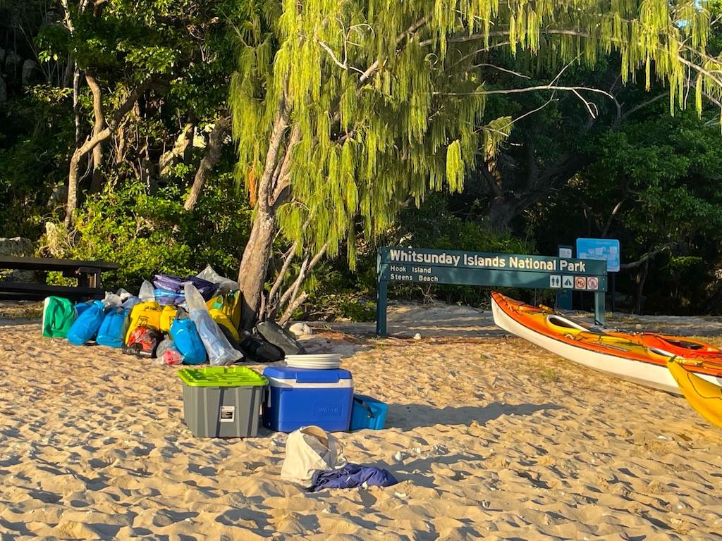 orange kayak and gear on an International sea kayaking trip